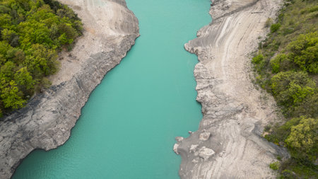 Scenic view of Lake Monteynard-Avignonet in a canyon in the French Alps near Grenoble, turquoise mountain lake surrounded by alpine peaks and forestsの写真素材