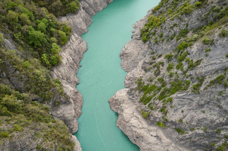 Scenic view of Lake Monteynard-Avignonet in a canyon in the French Alps near Grenoble, turquoise mountain lake surrounded by alpine peaks and forestsの写真素材
