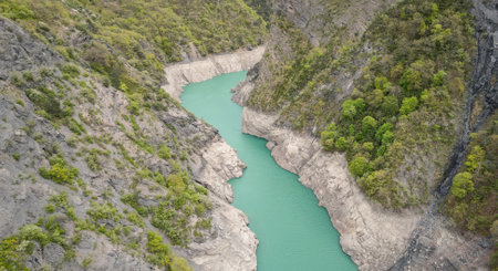 Scenic view of Lake Monteynard-Avignonet in a canyon in the French Alps near Grenoble, turquoise mountain lake surrounded by alpine peaks and forestsの写真素材