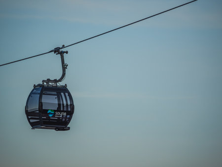 Solina, Poland - June 6, 2024: Cable Car Over Solina Lake Dam at Dusk with Full Moon in the...