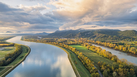 Sunrise Landscape over Rhone River in France with Mountains, Fields and Scenic Nature, Aerial View...