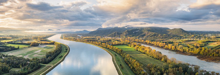 Sunrise Landscape over Rhone River in France with Mountains, Fields and Scenic Nature, Aerial View...