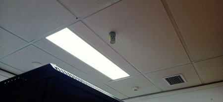 Ceiling lights and ventilation system in the roomの写真素材