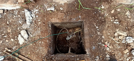 Close-up of a well for the installation of electrical cables.の写真素材