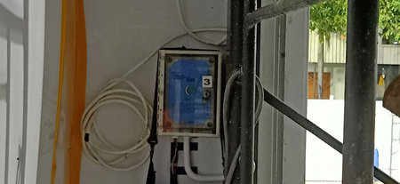 Electrical panel with wires on the wall of a residential building.の写真素材