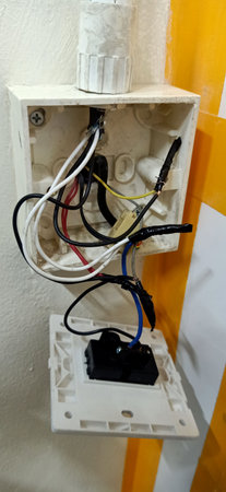 Electric power socket with wires and cables in a modern electrical installation.の写真素材