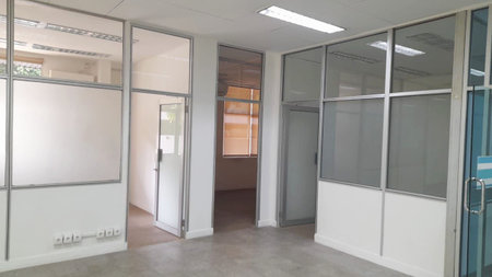 Empty office room with door and window. Nobody inside the room.の写真素材