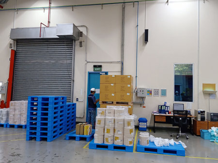 Warehouse worker unloading boxes in a warehouse, North China.の写真素材