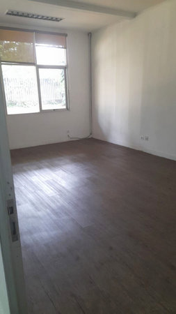 Interior of a room with wooden floor and white walls. Nobody insideの写真素材