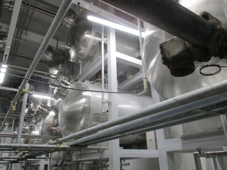 Equipment, cables and piping as found inside of a modern industrial power plant