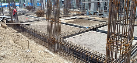 Construction site with steel framework for concrete pouring and reinforcement bar at building site