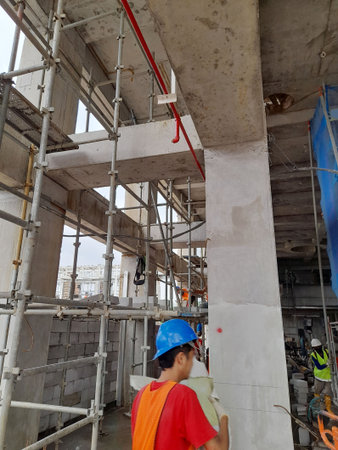Workers are working on the construction of a new residential building.