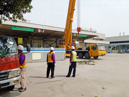 Unidentified engineers are working at construction site.