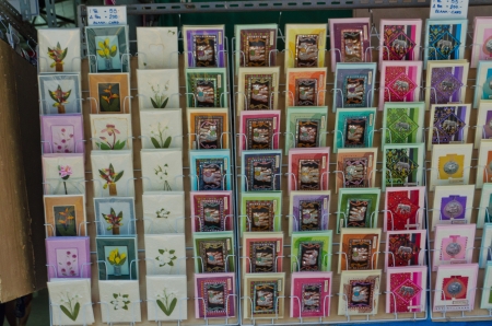 Postcard on shelf with many design for foreign to send from Thailandの写真素材