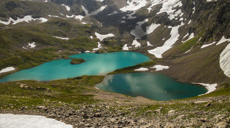 View of the Imereti Lake from the height of the mountain peak. Blue lake surrounded by mountains and...