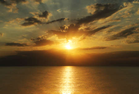 Beautiful orange sunset on a sea voyage. Calm evening sea.の写真素材