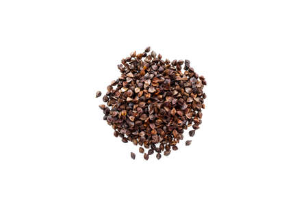 Isolate of a pile of unrefined whole buckwheat seeds. Pseudocereal agricultural crop. View from...