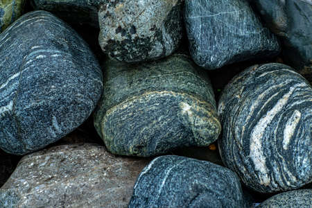 Abstract background texture of multicolored beautiful stones. Beautiful wet pebbles.の写真素材