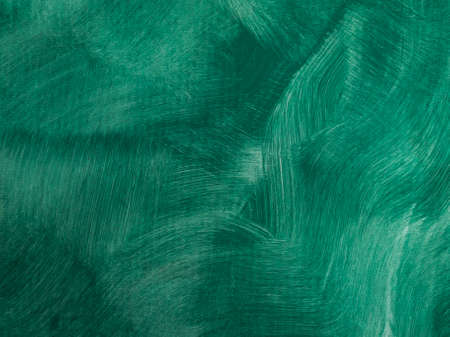 Background texture of a wall painted in green. Textured brush strokes. A wall with thin, irregular stripes.の写真素材