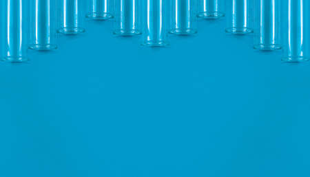 Chemical test tubes on a blue background with a blank space for your text.