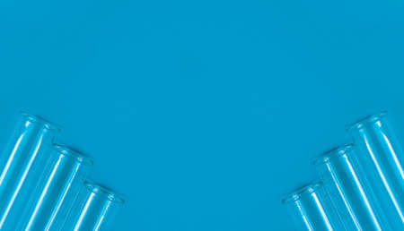Chemical test tubes on a blue background with a blank space for your text.