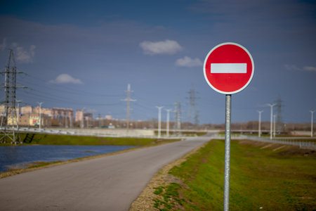 close-up of a stop road sign against a blue cloudy sky. Horizontal crop.の写真素材