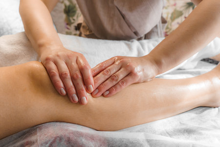Natural medicine, reflexology, woman getting calf massage, depressing energy points, spa center,...