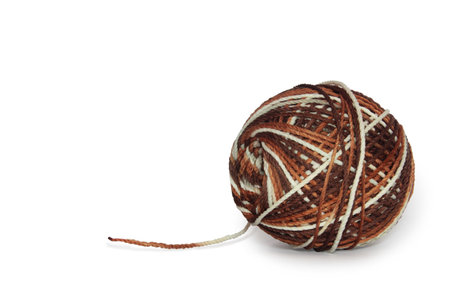 Polyester yarn balls in mixed colors white, brown. Can be used for crochet. Isolated on a white backgroundの写真素材