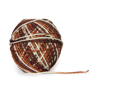 Polyester yarn balls in mixed colors white, brown. Can be used for crochet. Isolated on a white backgroundの写真素材