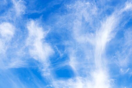 Beautiful abstract background. Blue summer sky with white clouds. Natural colors.の写真素材