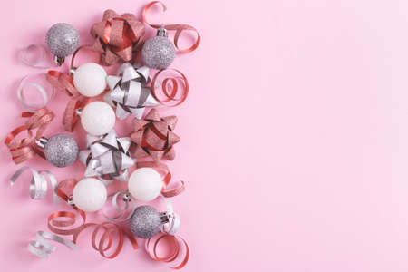 Festive Christmas decorations on pastel pink background. Flat lay, blank space.の写真素材
