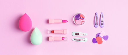 Makeup pink banner with colorful cosmetics and girl decorations. Knolling composition.
