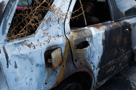An abandoned, stolen burnt out car. Full HD photo.の写真素材