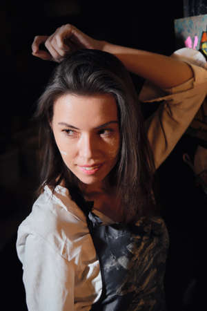 Portrait of a beautiful girl in a pottery workshopの写真素材