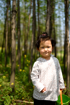 baby girl in the woodsの写真素材