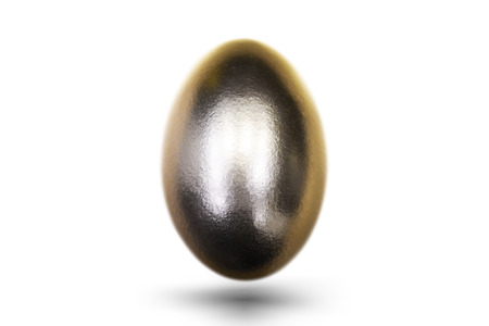 Golden egg for Easter on white backgroundの写真素材