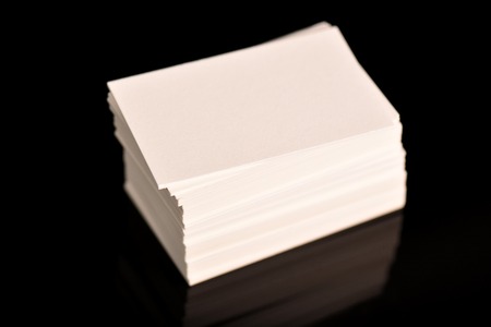 White Business Cards, flyer or banner Mockup. Blank empty template of paper cards on black background.の写真素材