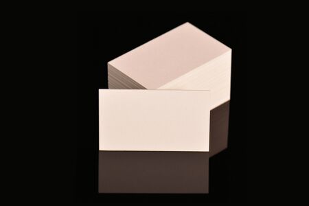 White Business Cards, flyer or banner Mockup. Blank empty template of paper cards on black background.の写真素材