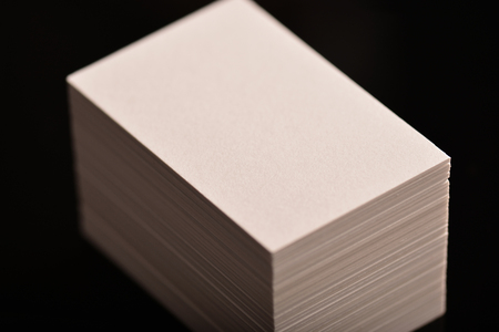 White Business Cards, flyer or banner Mockup. Blank empty template of paper cards on black...