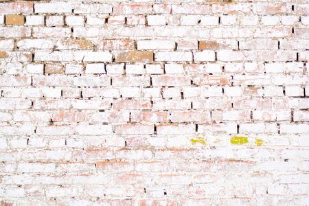 Ancient old brick white wall with moss. Brick Texture of old wallの写真素材