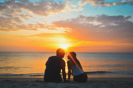 Couple On Beach At Sunset Summer Vacation, Beautiful Young People In Love seting, Man Woman Holding Hands Sea Ocean Holiday Travelの写真素材