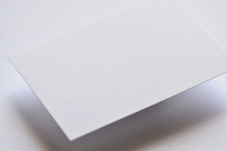 Photo of blank white business cards on white.の写真素材