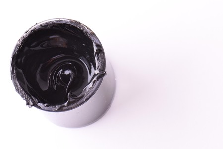 Black the Color Isolated. Open, full bin of black paint. White backgroundの写真素材