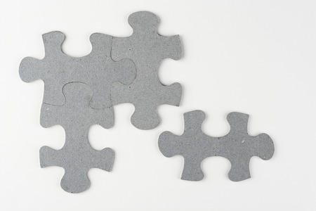 White copyspace empty gray background with gray puzzle piecesの写真素材