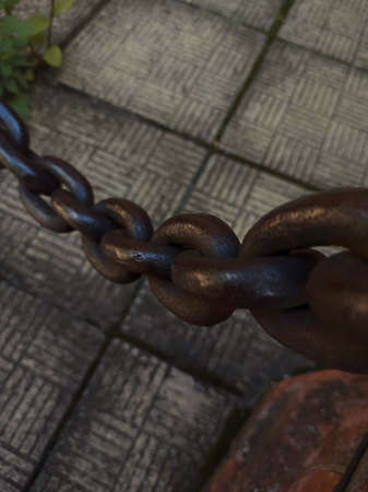 Big old rusty metal chain. Close up top view.