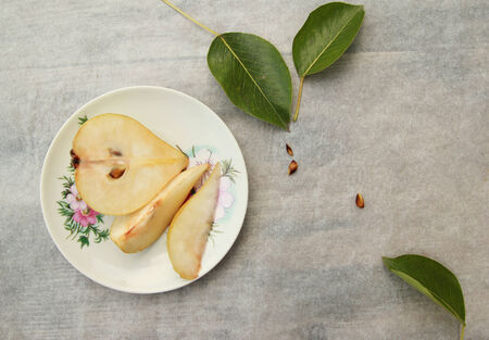 Sliced pears on the old fashioned plateの写真素材