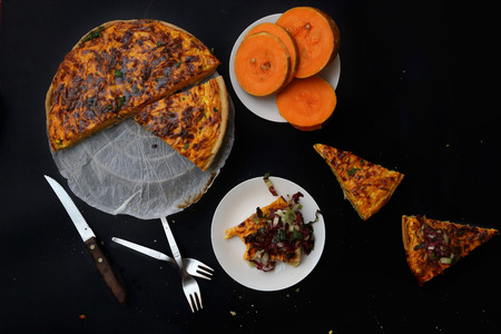 Homemade pumpkin tart on blackの写真素材