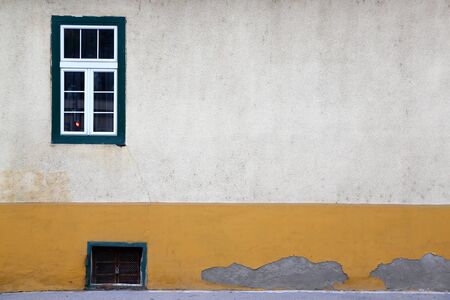 White window on the old wallの写真素材