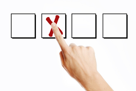 Male finger pressing X mark on virtual screen.の写真素材