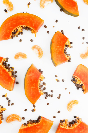 Papaya and mandarine fruit backgroundの写真素材